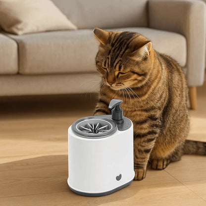 Pet foot washer with pump and round massage cup, shown with a sitting cat